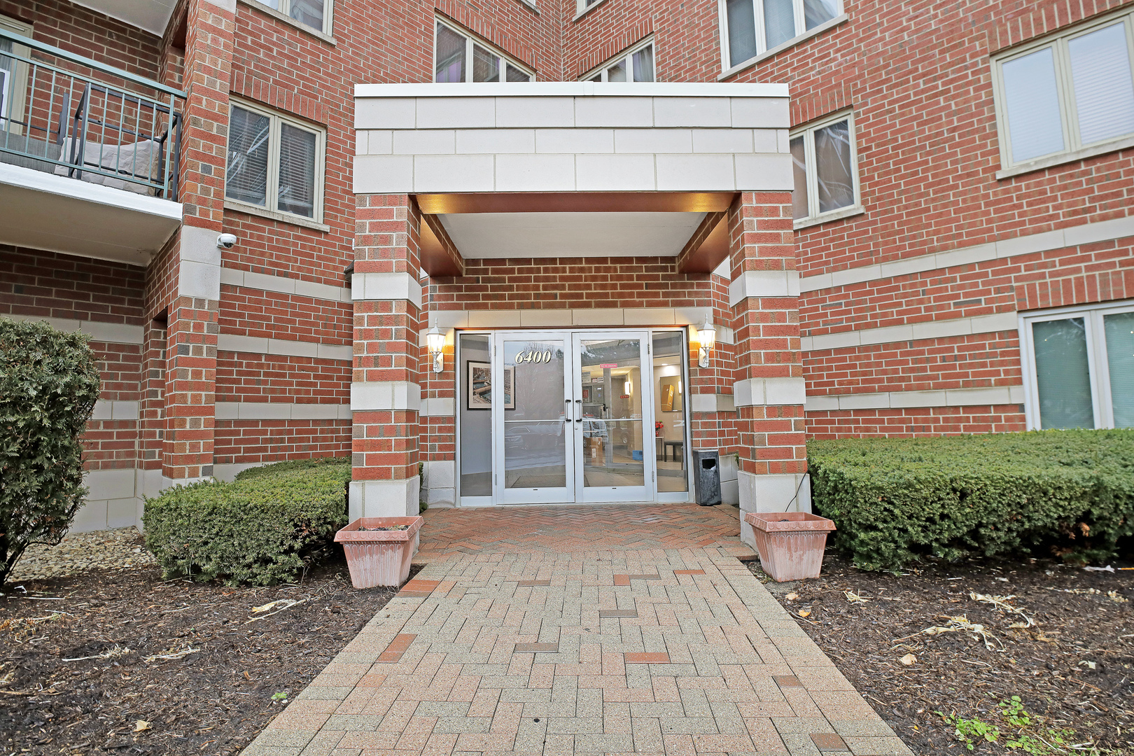 6400 West Berteau Avenue, Unit 405 Chicago, IL 60634 - Photo 2 of 22 a front view of a house with a porch