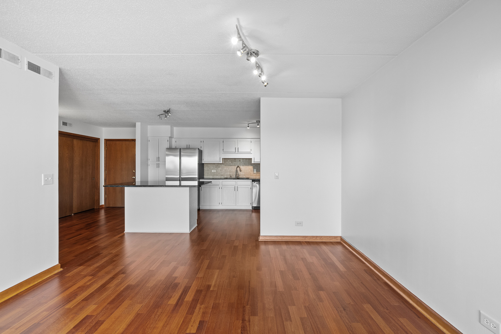 6400 West Berteau Avenue, Unit 405 Chicago, IL 60634 - Photo 8 of 22 a view of kitchen with wooden floor