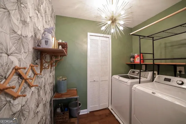 a bedroom with a flat screen tv and a bed