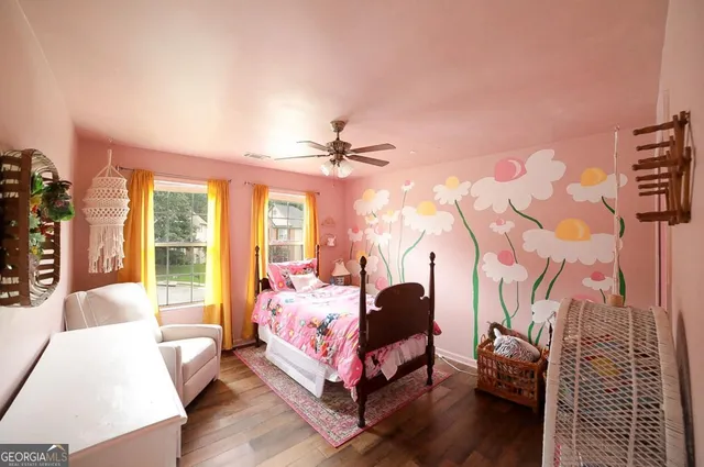 a view of a lounge chairs in back yard of the house
