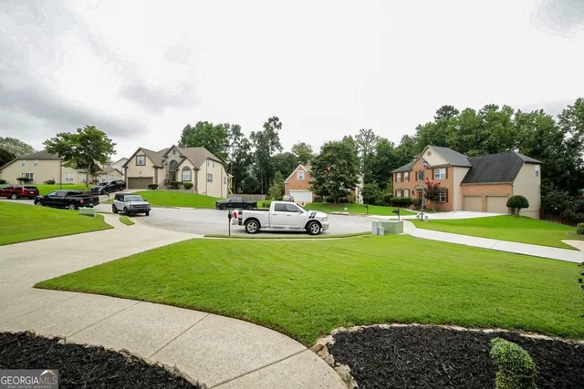 a front view of a house with a yard