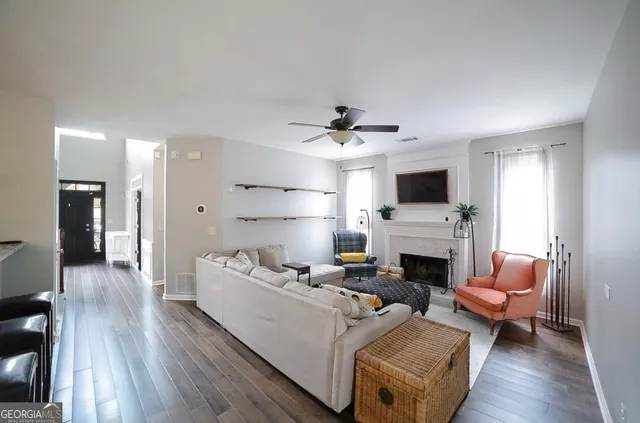 a living room with furniture rug and window