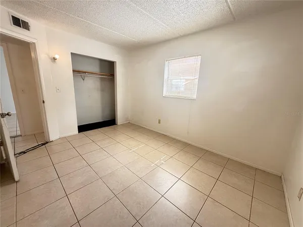 a view of an empty room and entryway