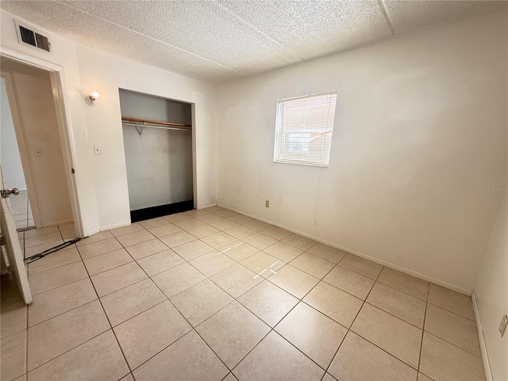 731 Michigan Court, Unit 1 St. Cloud, FL 34769 - Photo 13 of 18 a view of an empty room and entryway