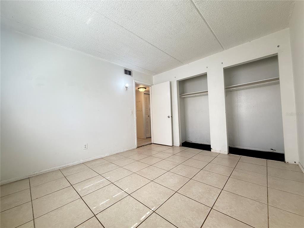 731 Michigan Court, Unit 1 St. Cloud, FL 34769 - Photo 16 of 18 a view of an empty room and window