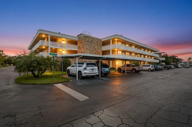 a view of a big building next to a road