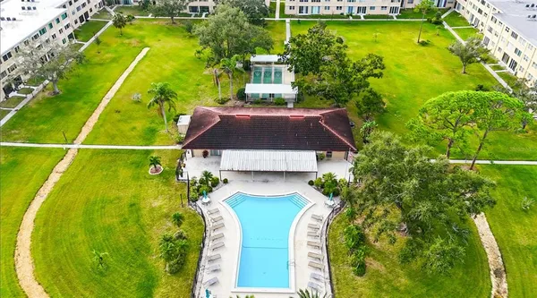 a view of a swimming pool with a garden