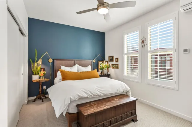 a bedroom with a bed and window