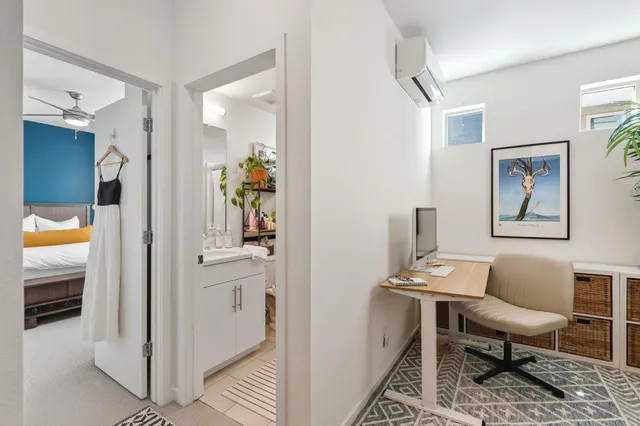 a view of a livingroom with furniture and window