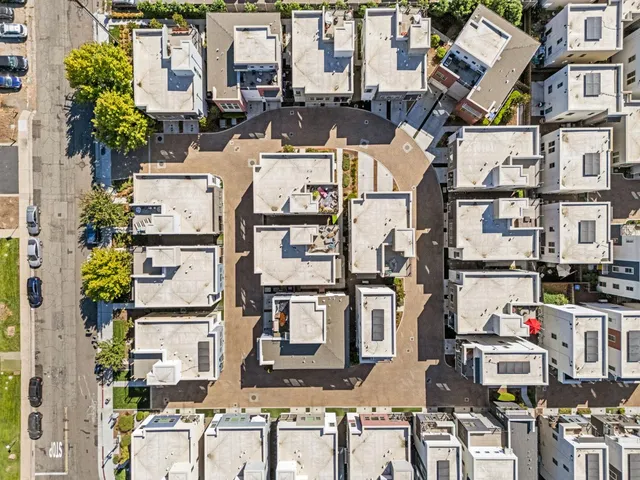 an aerial view of a house with a swimming pool