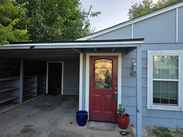 a view of a house with a door and a balcony
