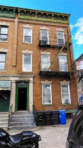 a view of a car park in front of house
