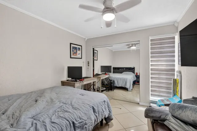 a bedroom with a bed and a couch