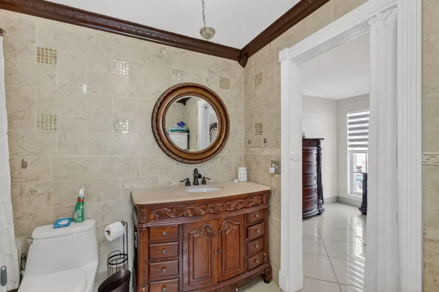 a bathroom with a sink a vanity and a mirror