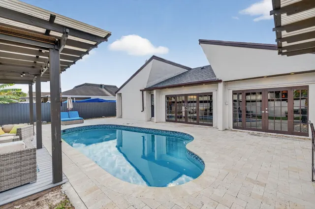 a view of a house with a tub and wooden floor