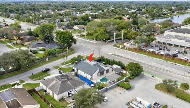 an aerial view of a house with a garden
