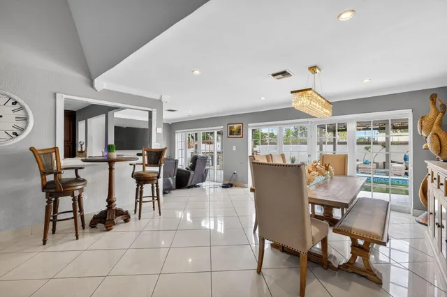 a view of a dining room with furniture and a livingroom