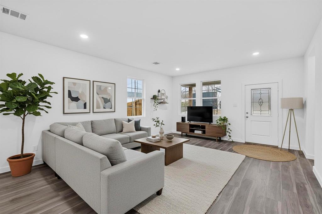 4606 Metropolitan Avenue Dallas, TX 75210 - Photo 4 of 21 a living room with furniture and a flat screen tv