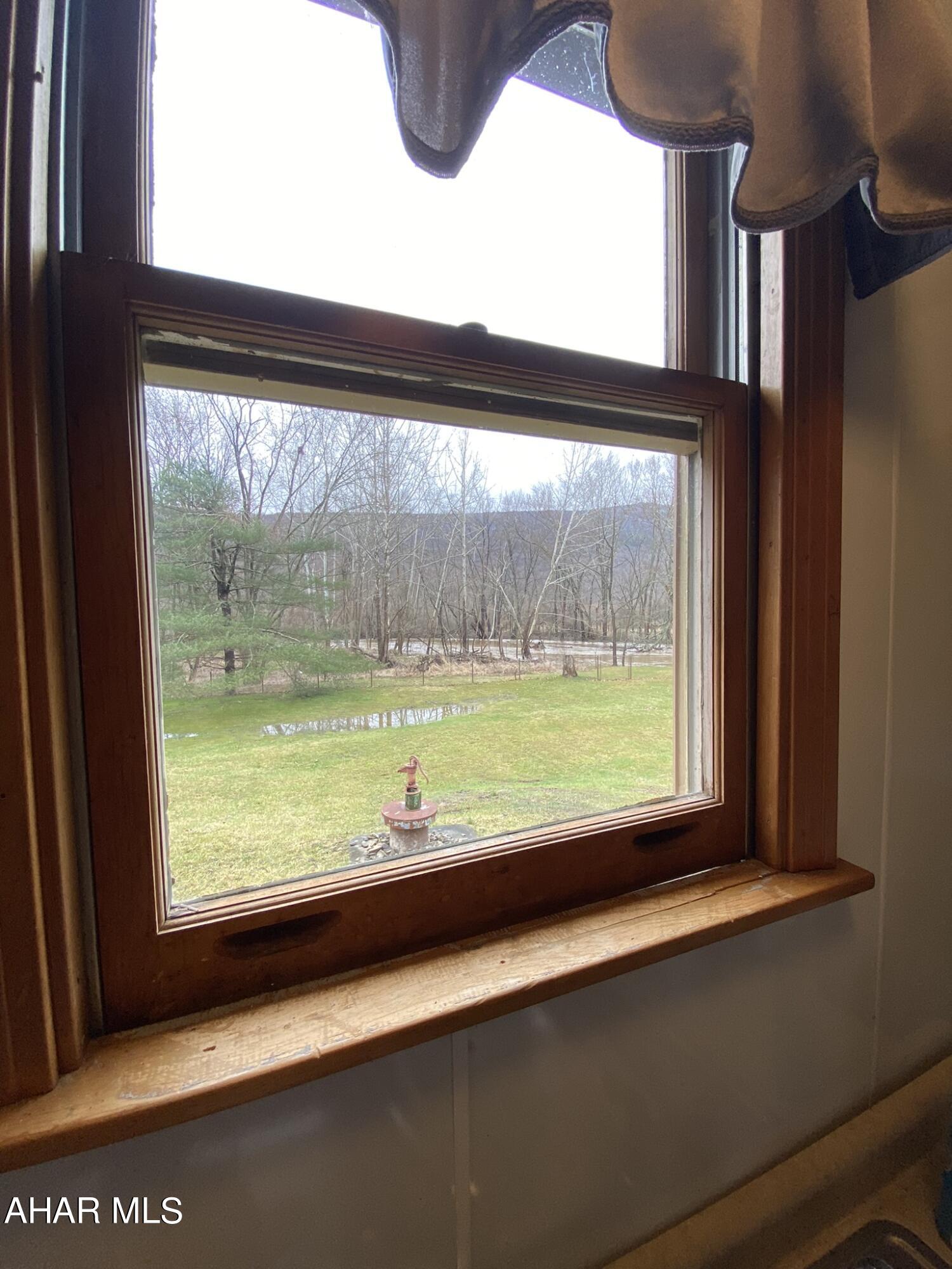 157 Stuckeysville Road Manns Choice, PA 15550 - Photo 7 of 28 a view of a room with a large window and front door