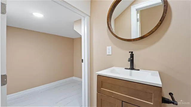 a bathroom with a sink and a mirror