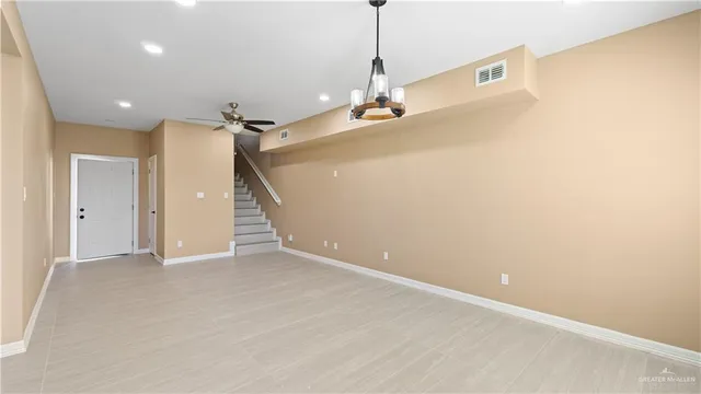 a view of a big room with windows