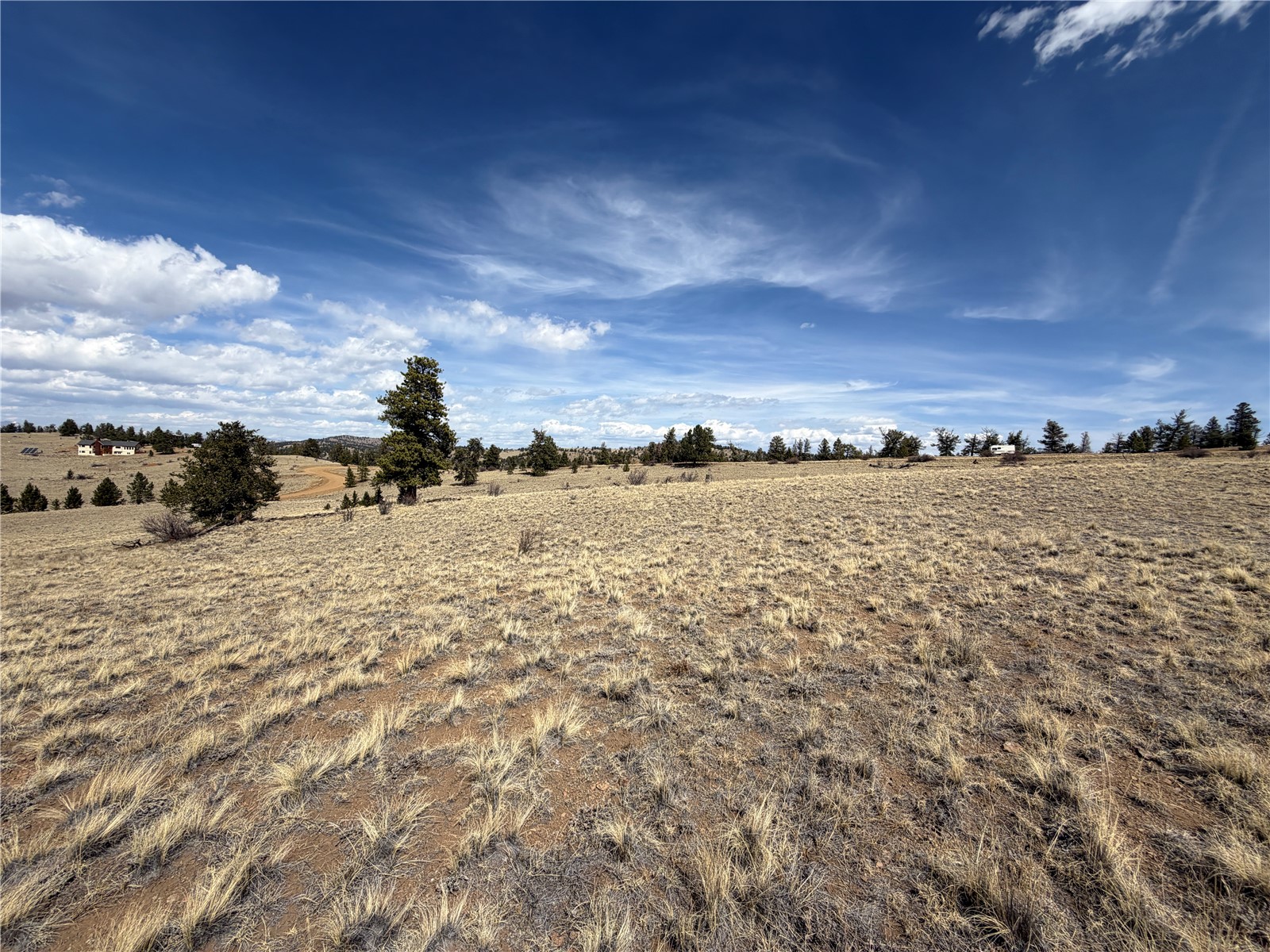2839 Fitzsimmons Road Hartsel, CO 80449 - Photo 23 of 25 a view of a lake and sunset
