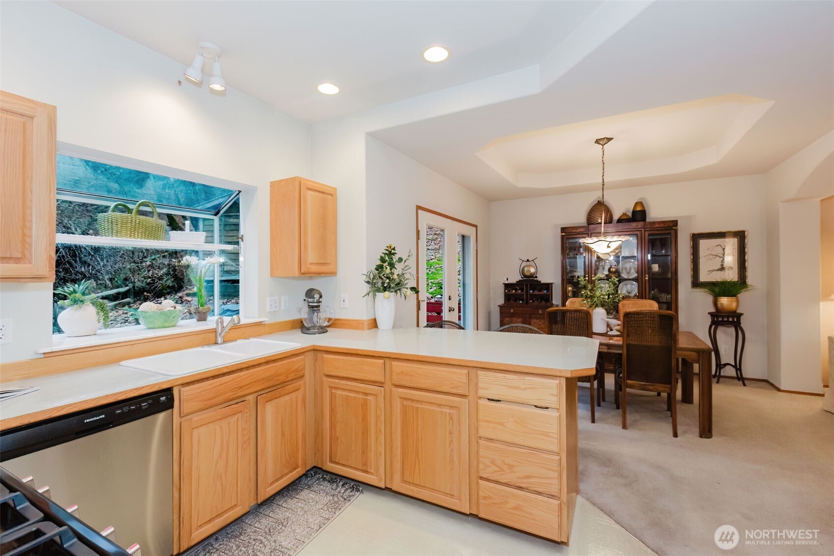 8911 Roanoke Road Northeast Bremerton, WA 98311 - Photo 13 of 40 a kitchen with sink and cabinets
