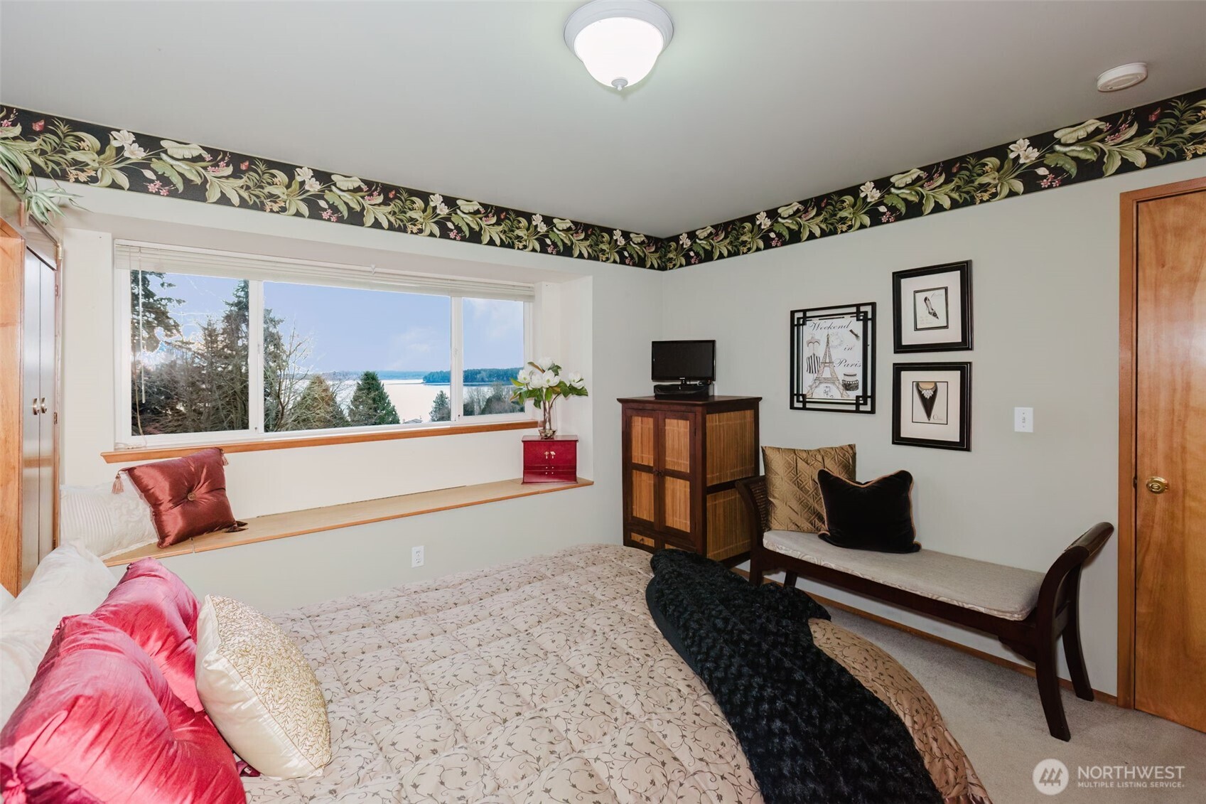 8911 Roanoke Road Northeast Bremerton, WA 98311 - Photo 18 of 40 a living room with furniture and a floor to ceiling window