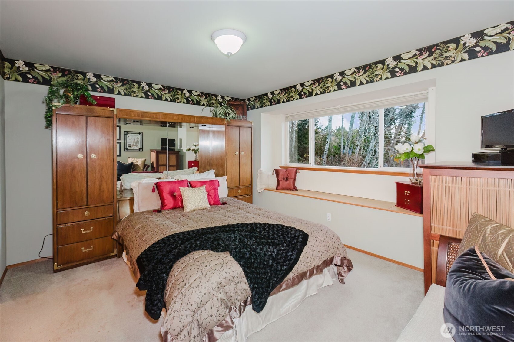 8911 Roanoke Road Northeast Bremerton, WA 98311 - Photo 19 of 40 a bedroom with a bed and a large window with the outer view