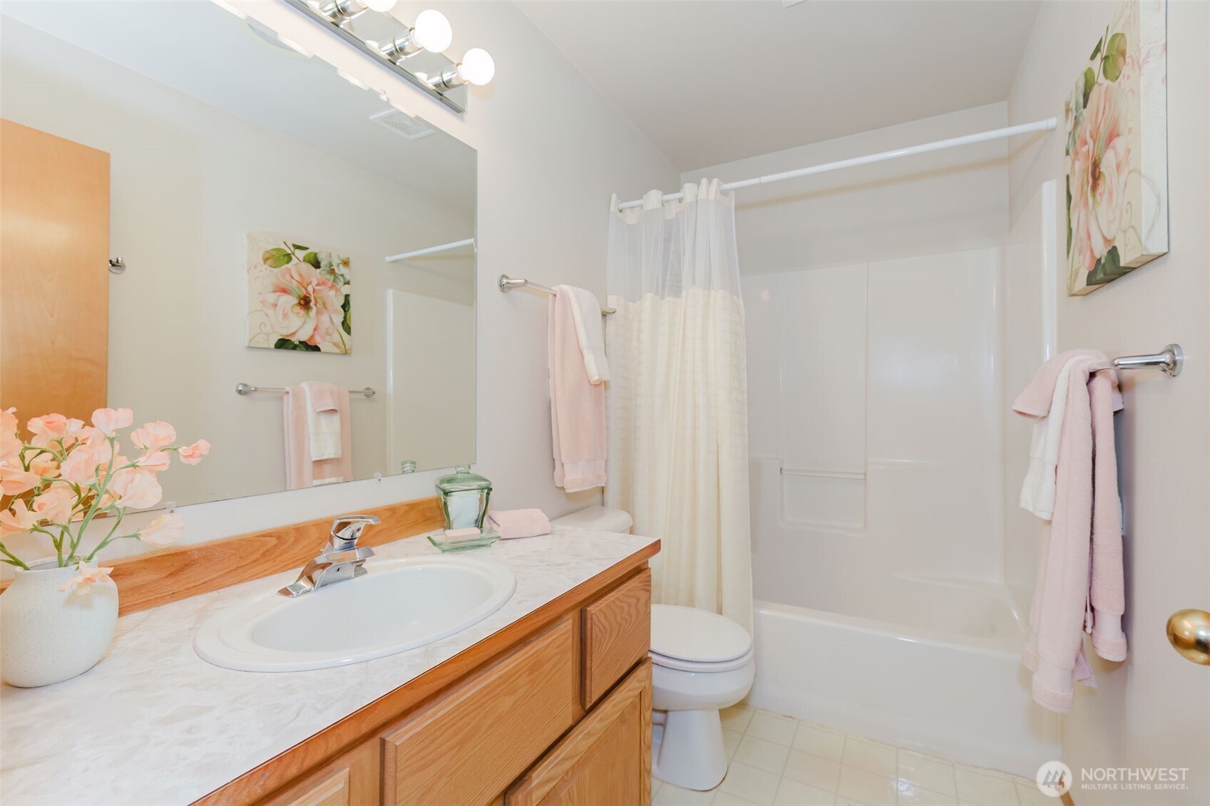 8911 Roanoke Road Northeast Bremerton, WA 98311 - Photo 21 of 40 a bathroom with a sink a toilet and shower