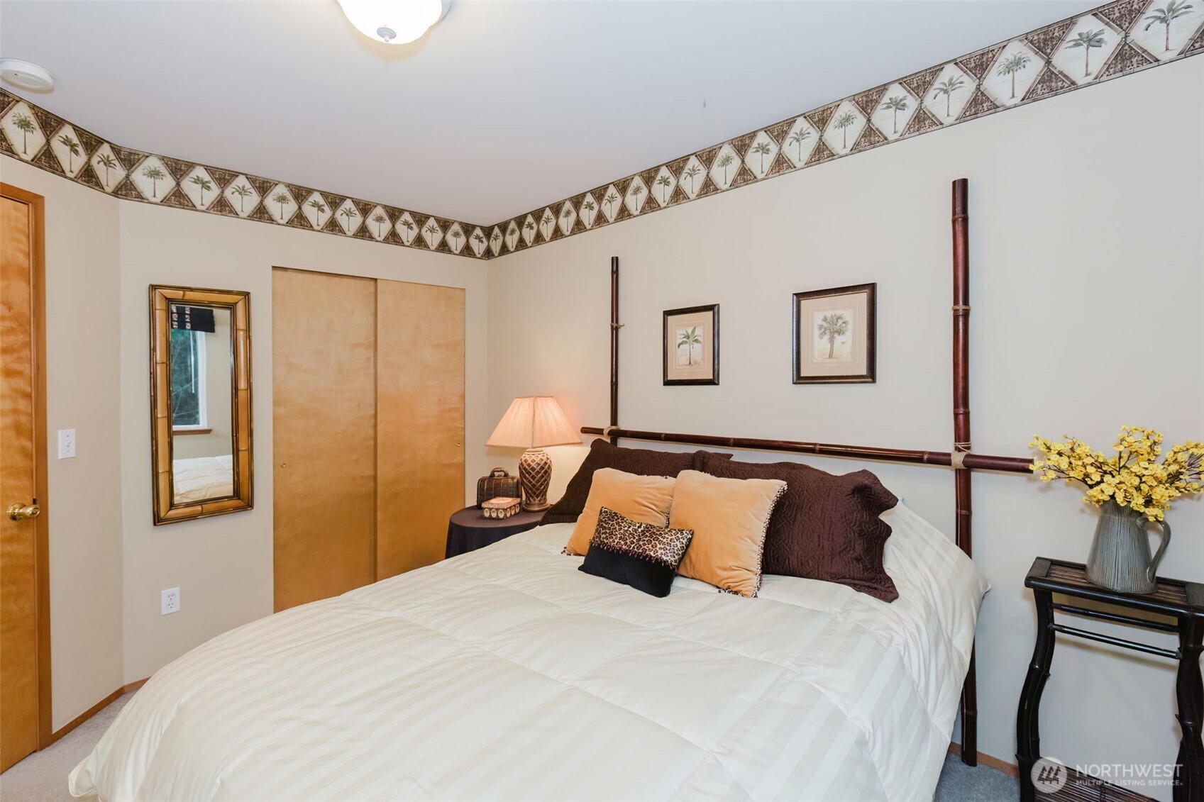 8911 Roanoke Road Northeast Bremerton, WA 98311 - Photo 24 of 40 a bedroom with bed and wooden floor