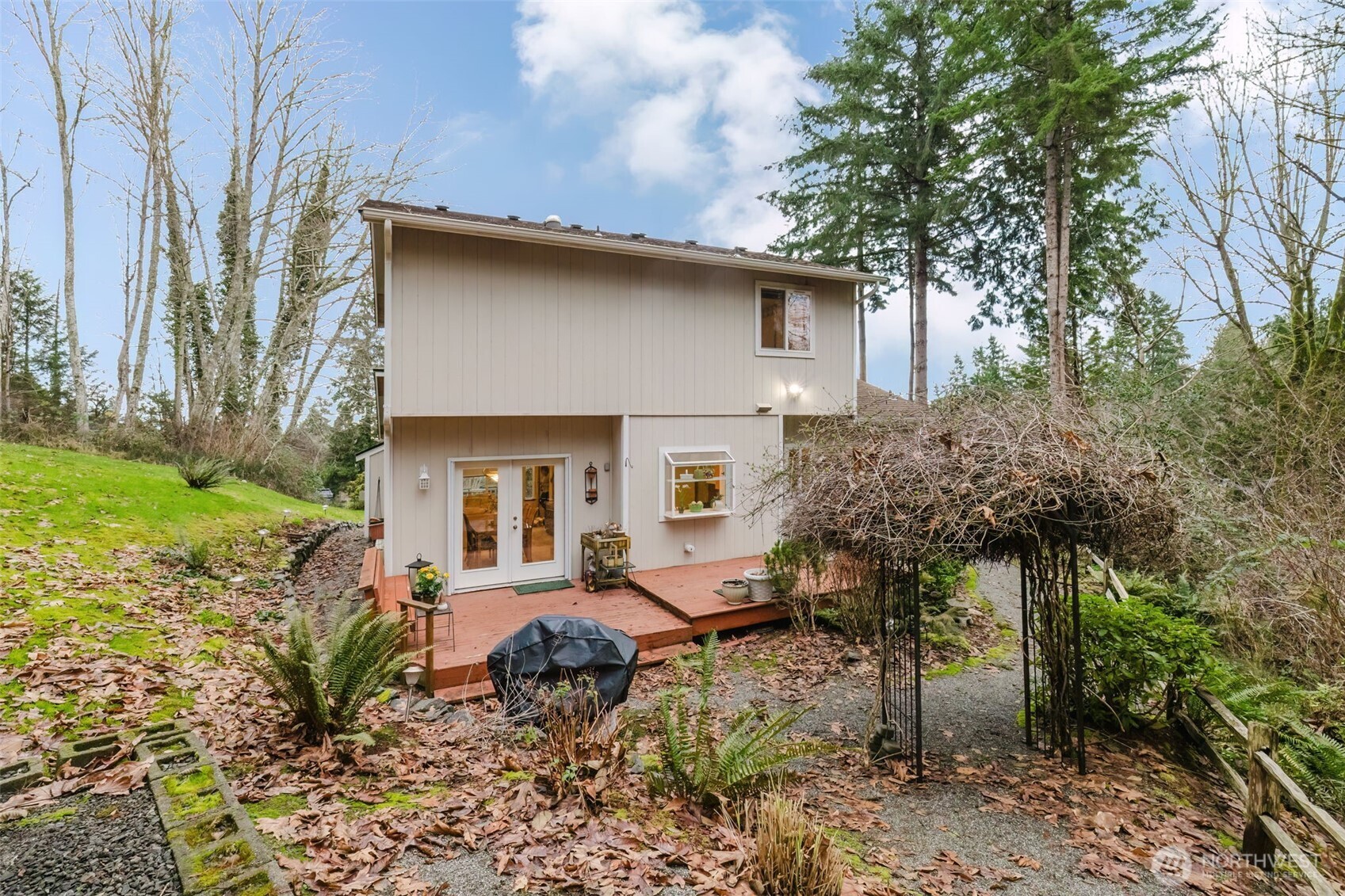 8911 Roanoke Road Northeast Bremerton, WA 98311 - Photo 31 of 40 a house view with a outdoor space
