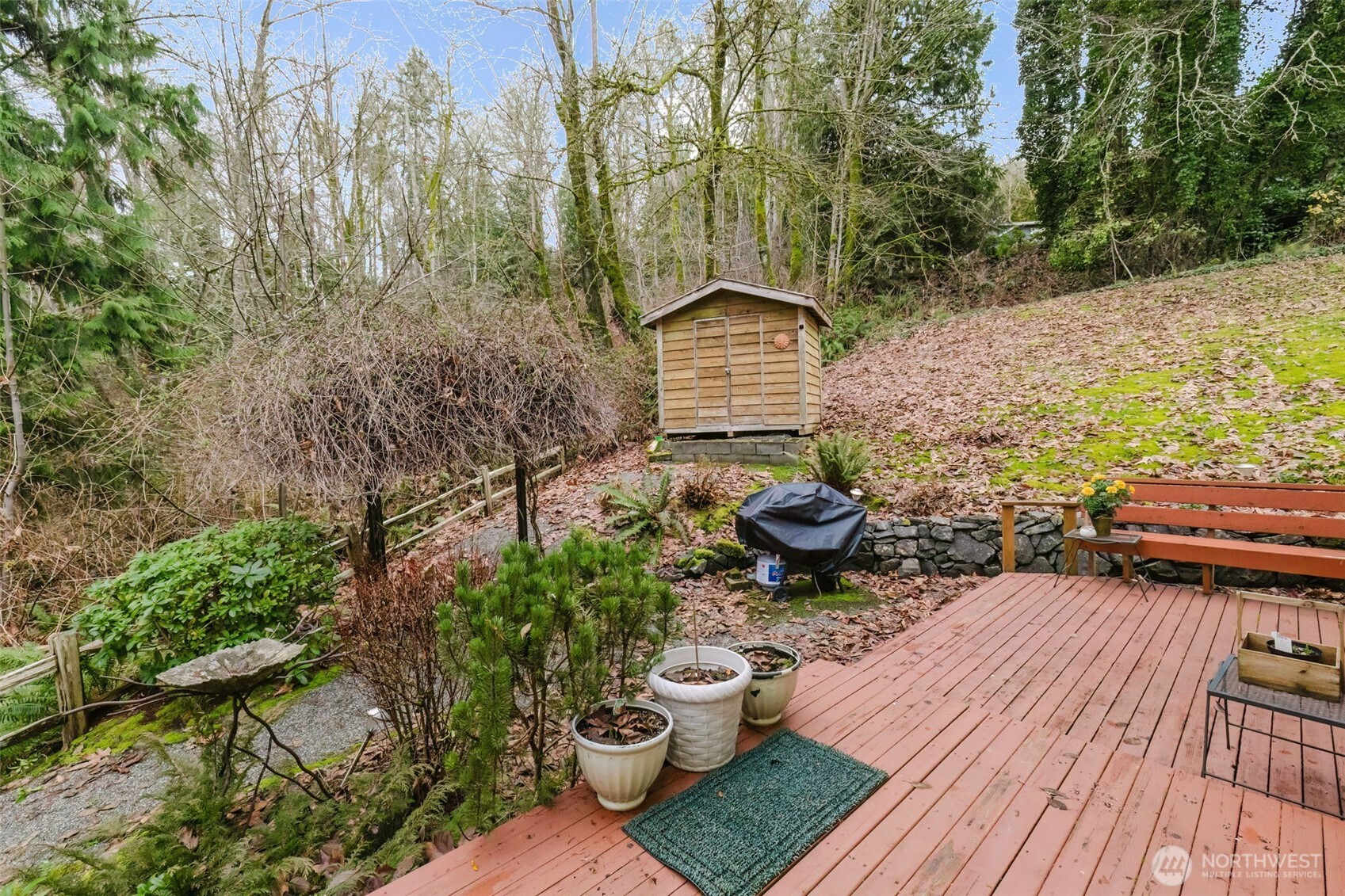 8911 Roanoke Road Northeast Bremerton, WA 98311 - Photo 32 of 40 a backyard of a house with seating space