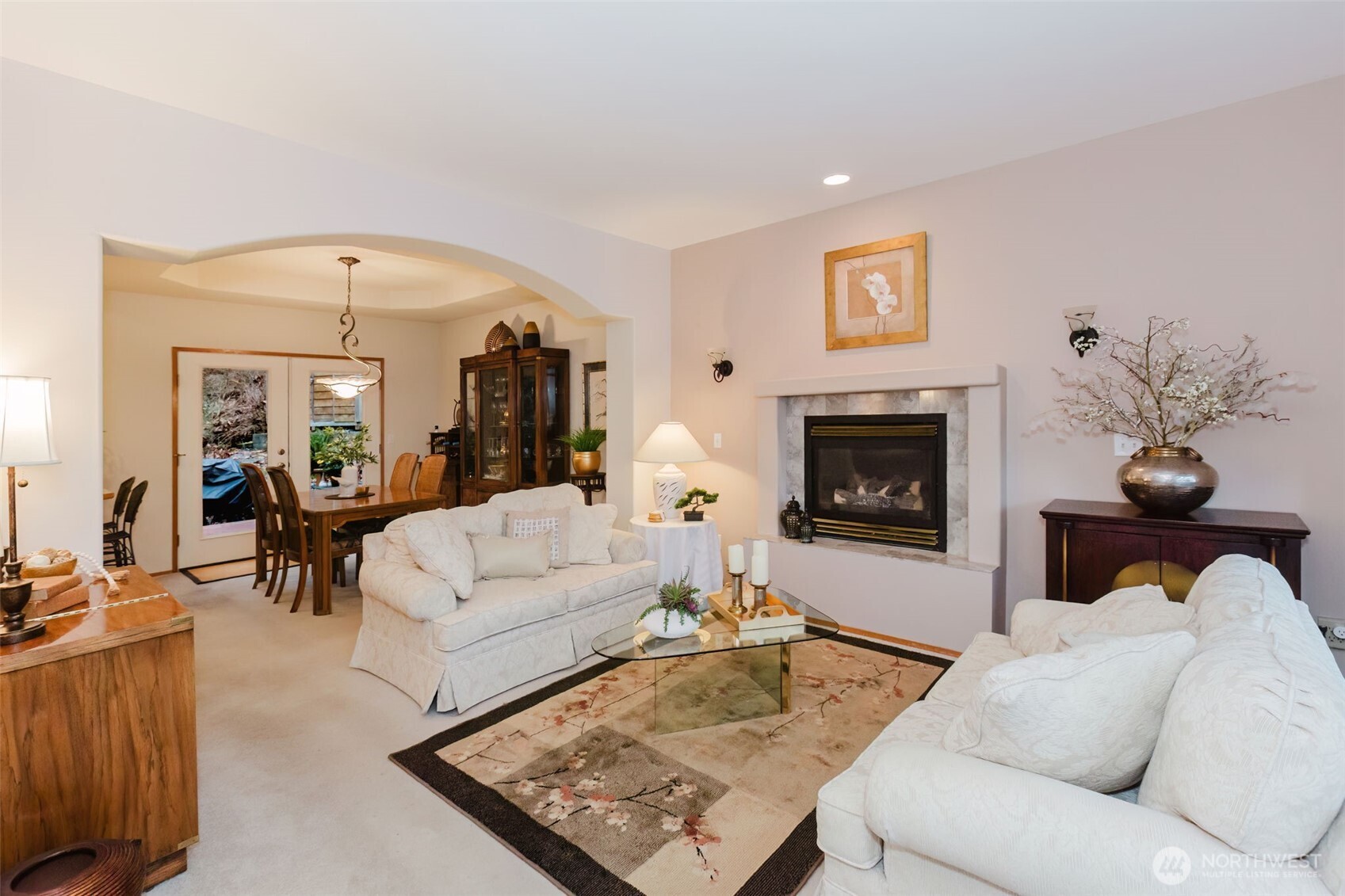 8911 Roanoke Road Northeast Bremerton, WA 98311 - Photo 4 of 40 a living room with furniture a fireplace and a flat screen tv