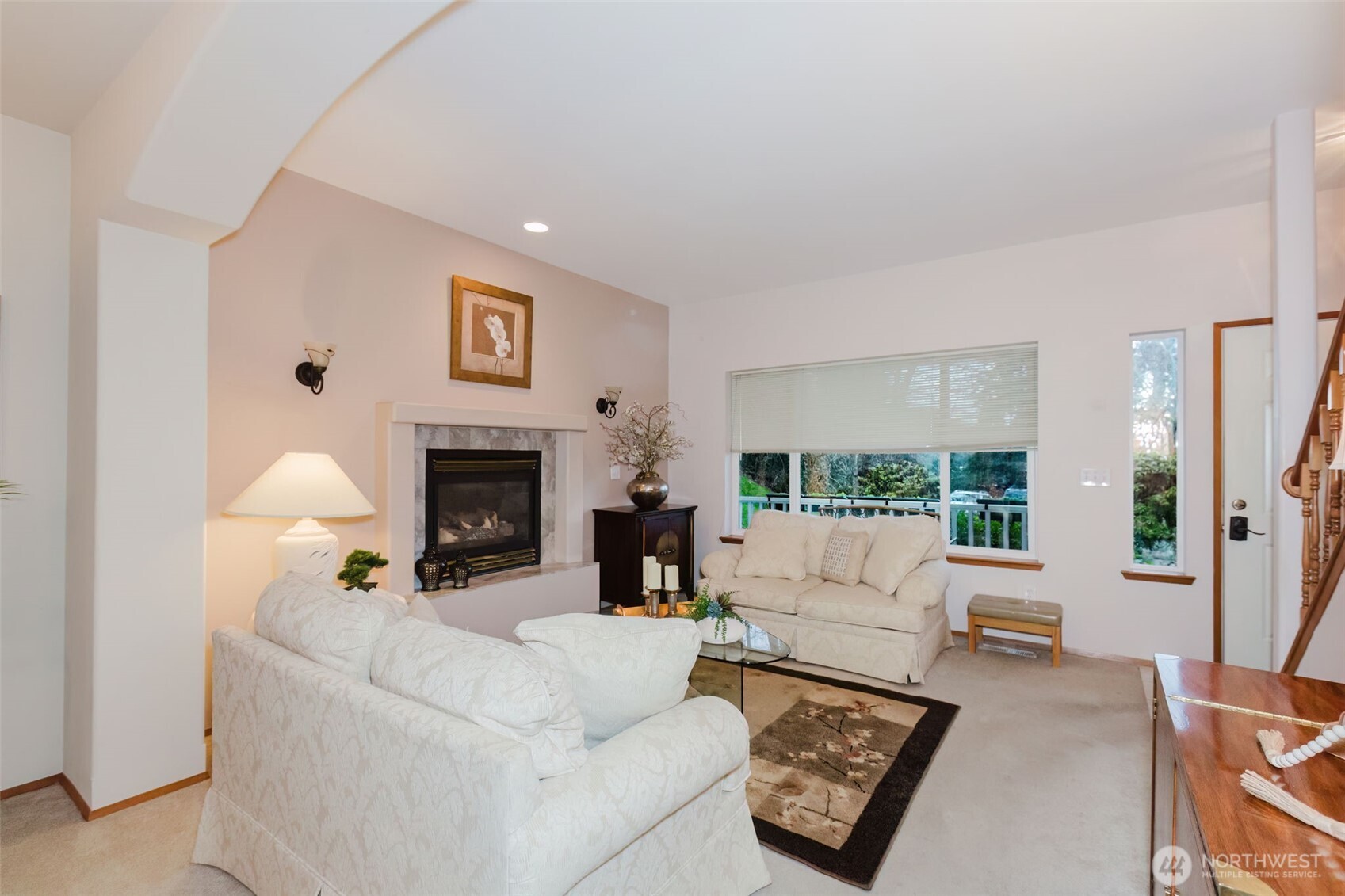 8911 Roanoke Road Northeast Bremerton, WA 98311 - Photo 5 of 40 a living room with furniture large window and a fireplace