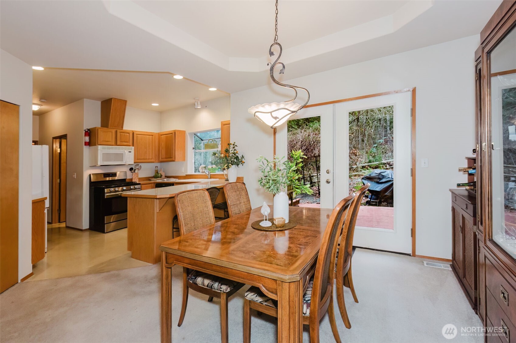 8911 Roanoke Road Northeast Bremerton, WA 98311 - Photo 8 of 40 a view of a dining room with furniture window and outside view