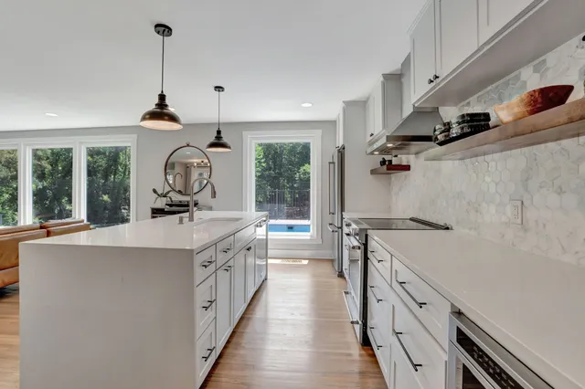 a kitchen with a sink and a stove