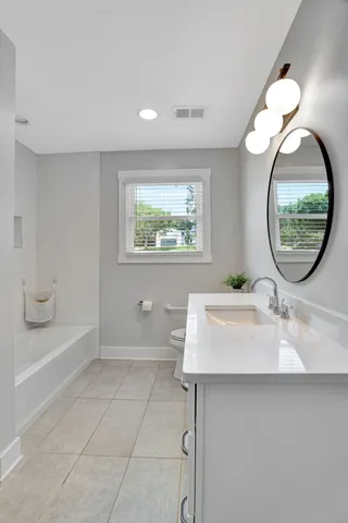 a bathroom with a shower and a bathtub