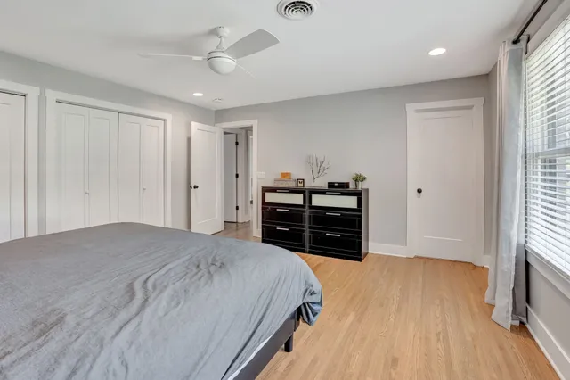 a bathroom with a double vanity sink mirror and shower