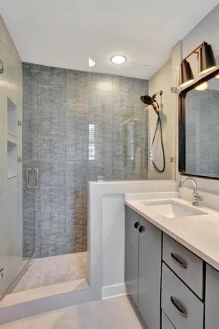 a view of a livingroom with furniture and a floor to ceiling window
