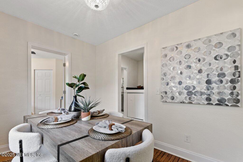 1263 Macarthur Street Jacksonville, FL 32205 - Photo 14 of 37 a view of a dining room with furniture and wooden floor