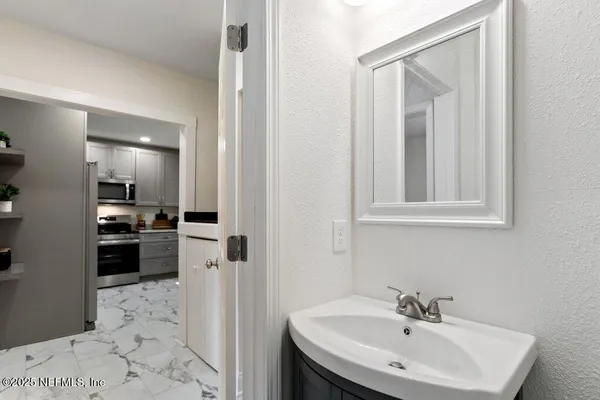a sink with granite countertop a sink and cabinets