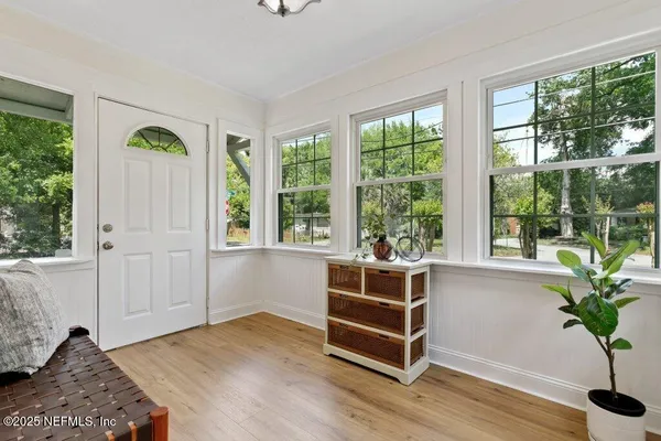 a living room with furniture and window