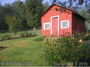 750 Rice Cove Road Canton, NC 28716 - Photo 2 of 9 a front view of a house with garden