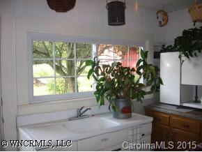 750 Rice Cove Road Canton, NC 28716 - Photo 6 of 9 a bathroom with a sink and a mirror