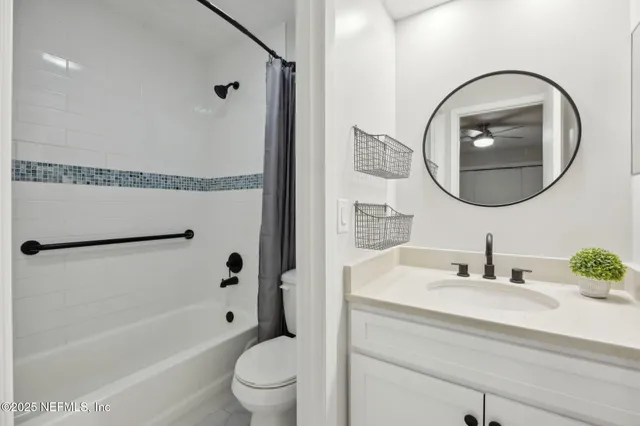 a bathroom with a toilet a sink and a bathtub