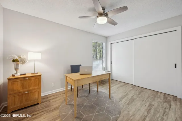 a workspace with furniture and window