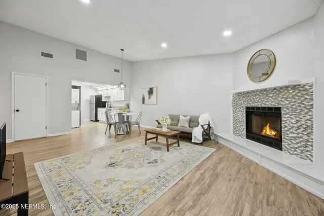 a living room with furniture and a fireplace