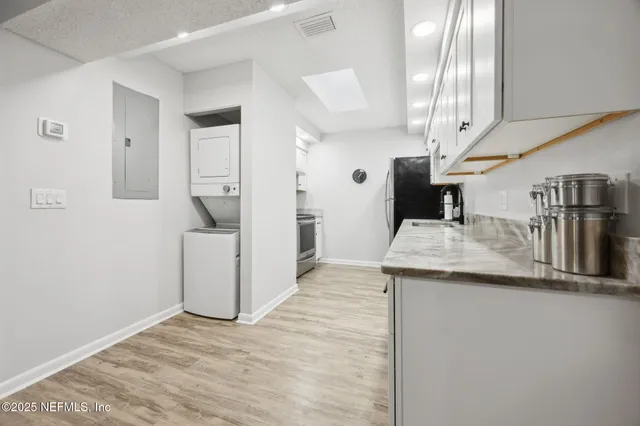 a kitchen with a sink and refrigerator