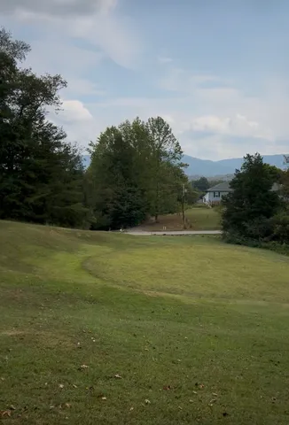 a view of an ocean and yard